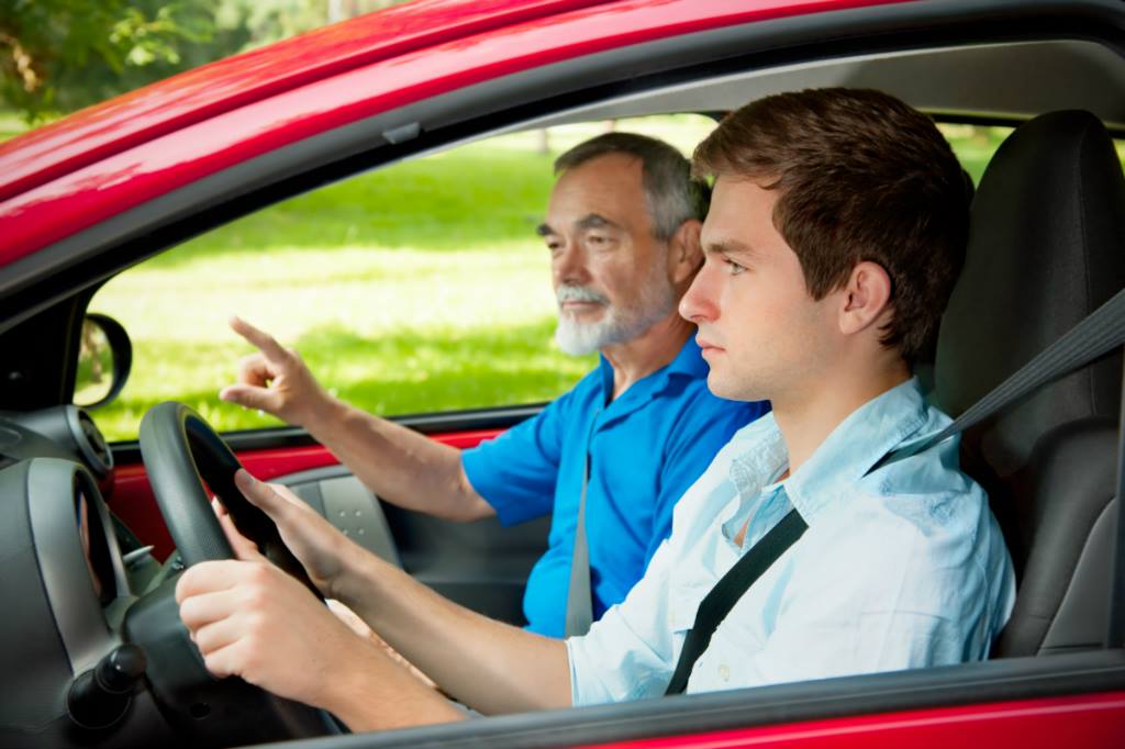 A man and his father are driving in the car.